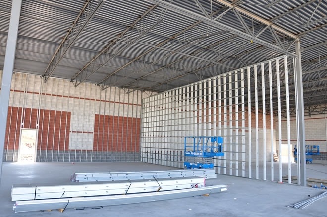 Large commercial warehouse framing — steel stud walls and open-web steel joists