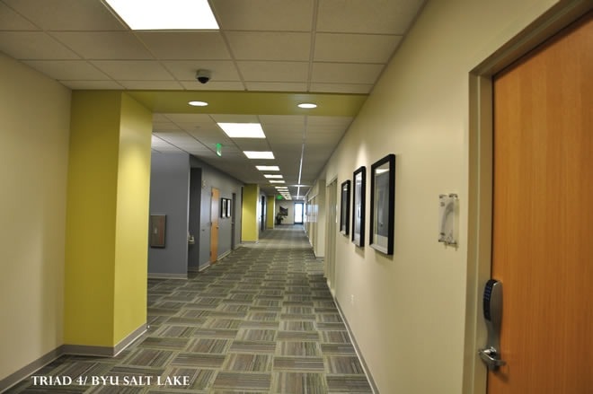 Triad 4 / BYU Salt Lake hallway — drywall finish with accent walls and ceiling tile